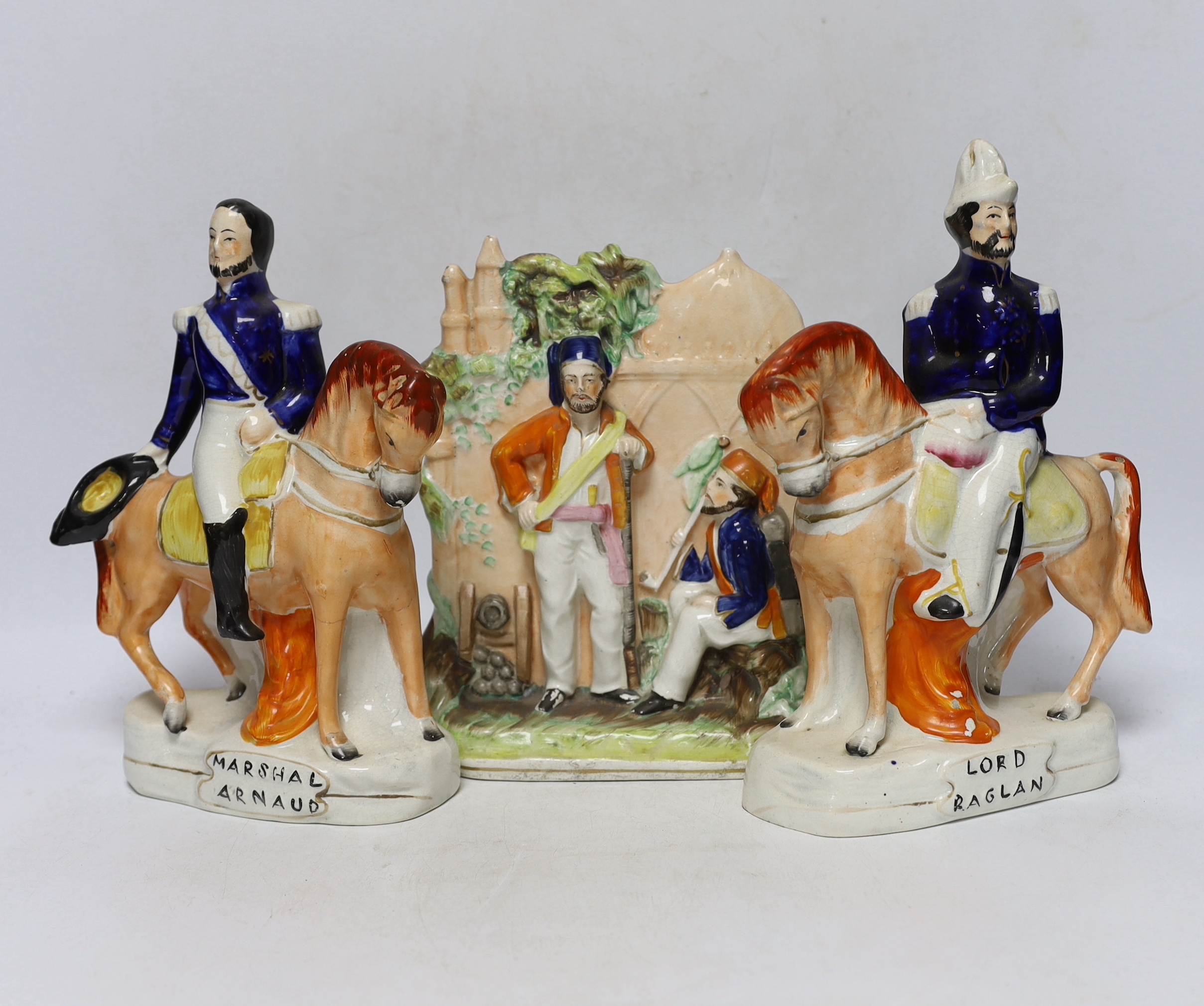 Three mid 19th century Staffordshire figure groups including Lord Raglan and Marshal Arnaud and Turkish soldiers, tallest 26.5cm